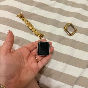 Apple Smartwatch with Gold Band and Black Screen